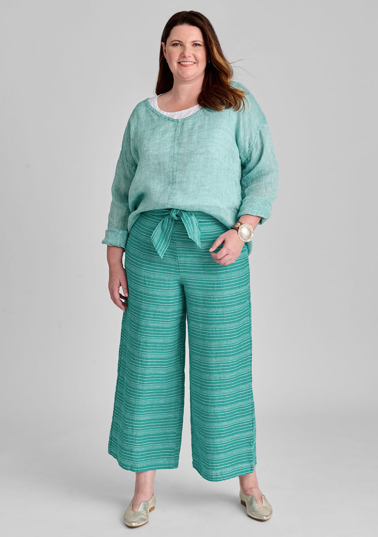 FLAX linen shirt in green with linen tank in white and linen pants in green