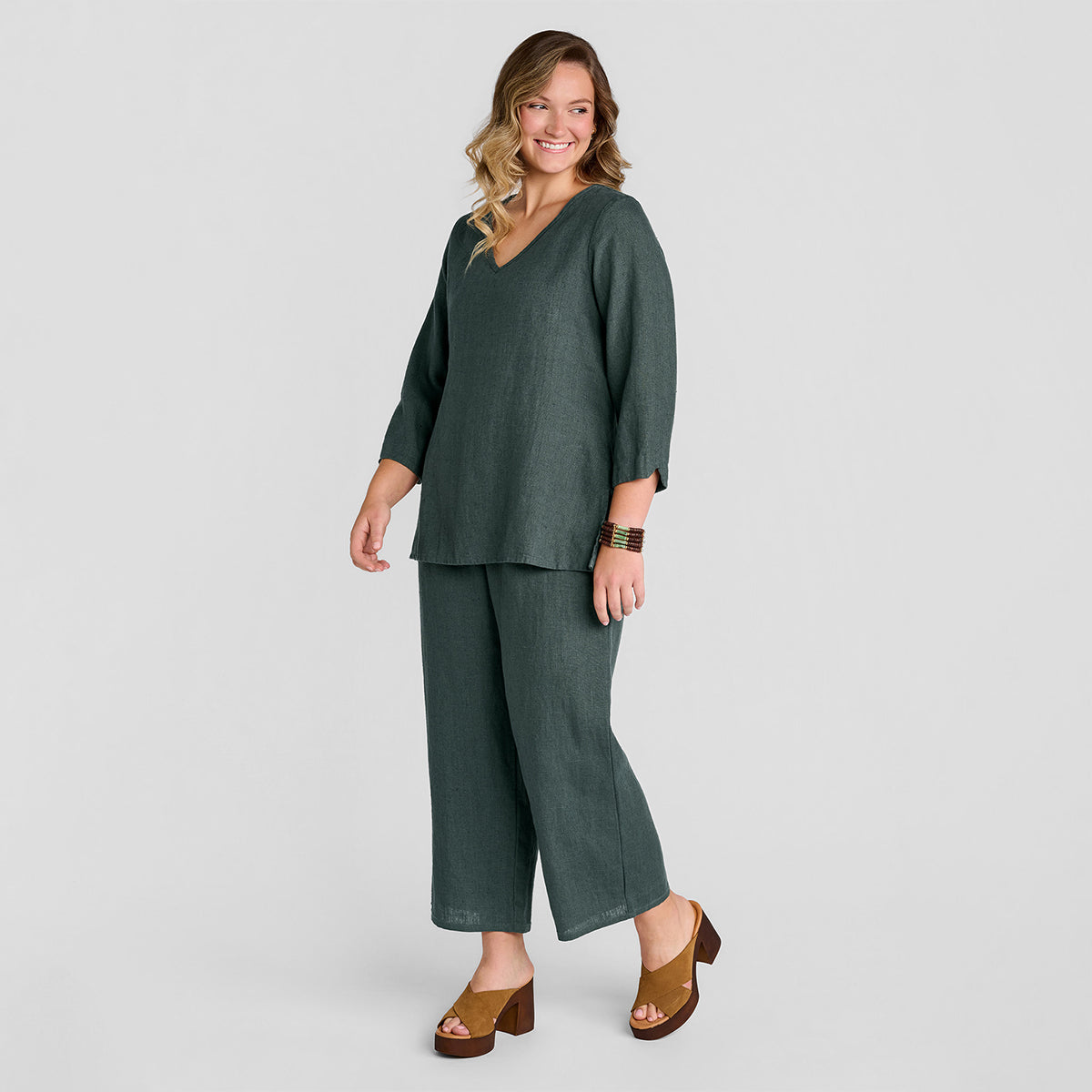 woman wearing head to toe outfit in green heavy weight linen