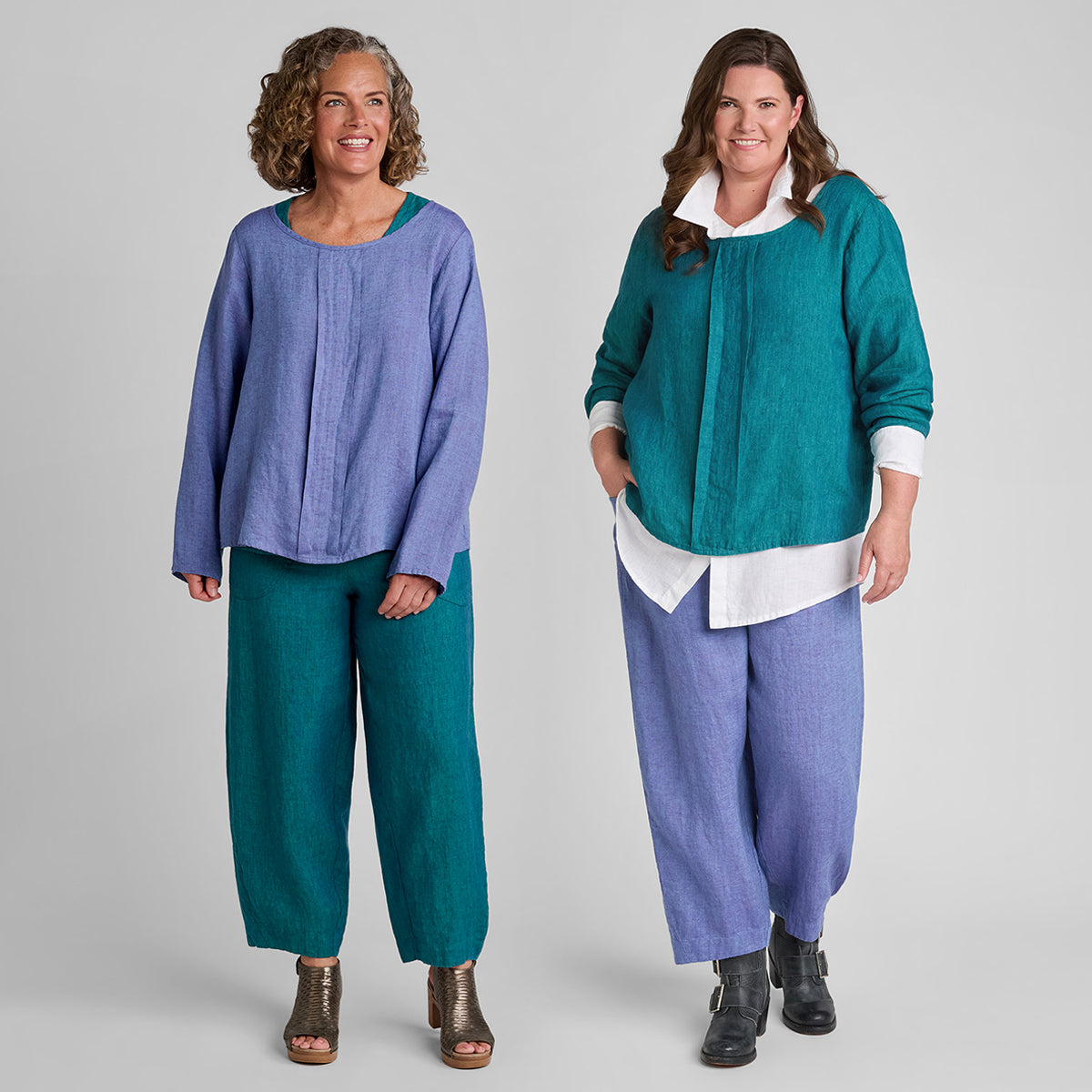 two women wearing purple and green linen outfits