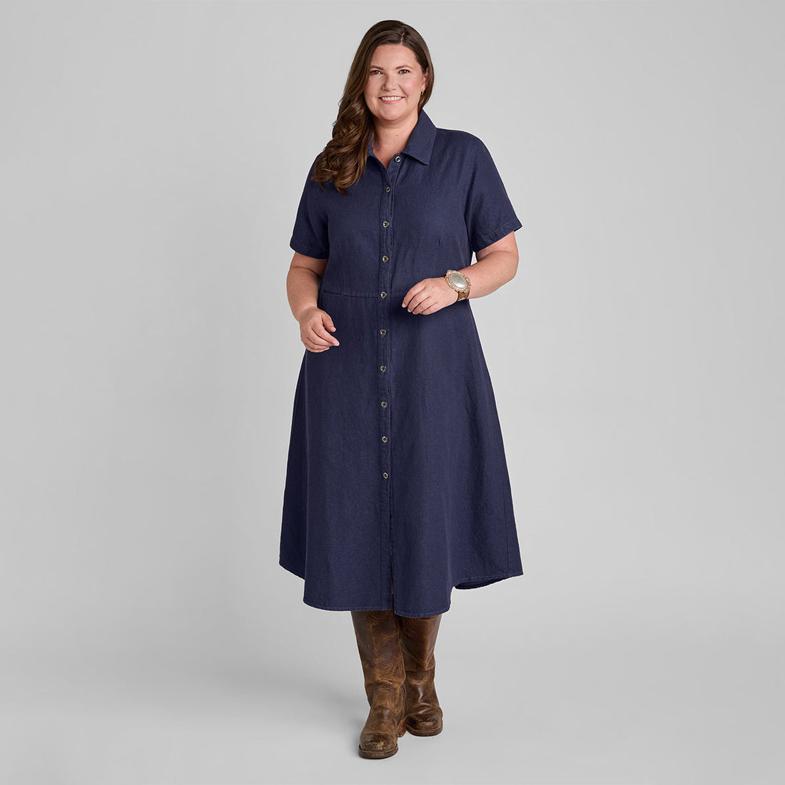 woman in a blue linen cotton button down dress