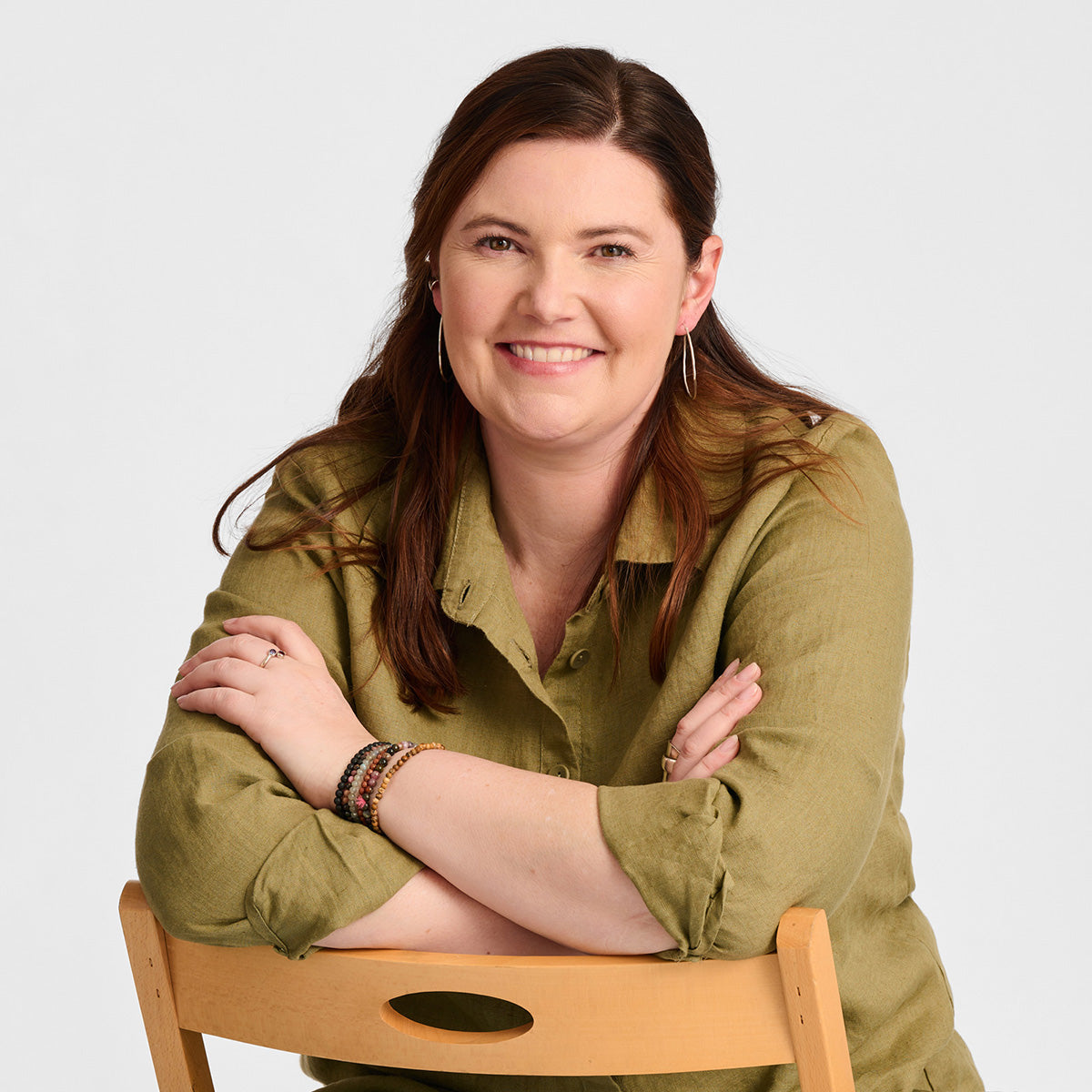 close up image of women sitting in a chair