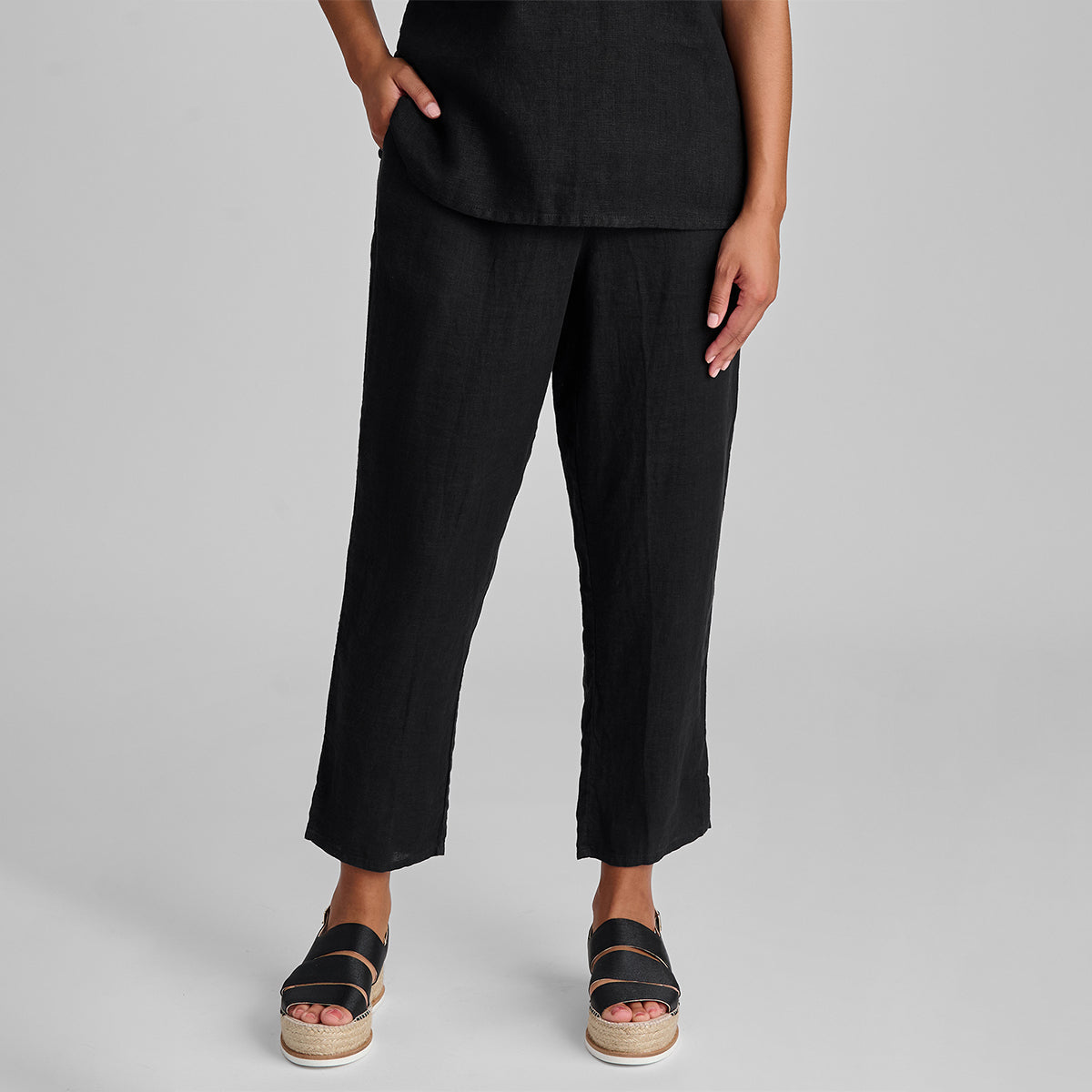 close up of linen tapered pants in black