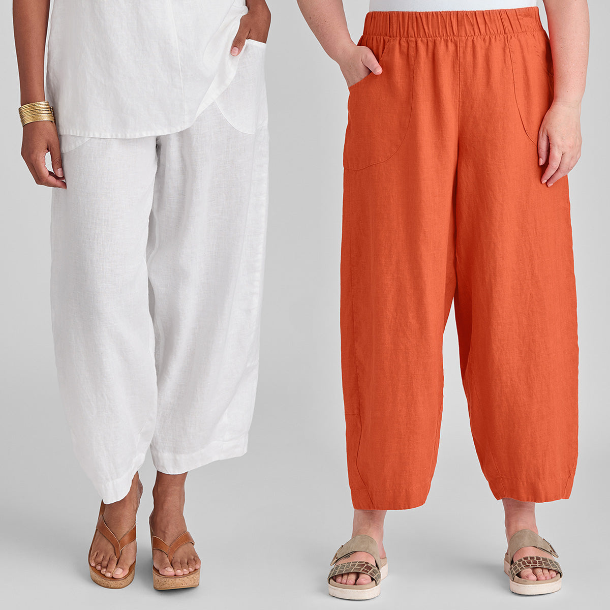 close up image of two woman wearing linen pants in white and orange