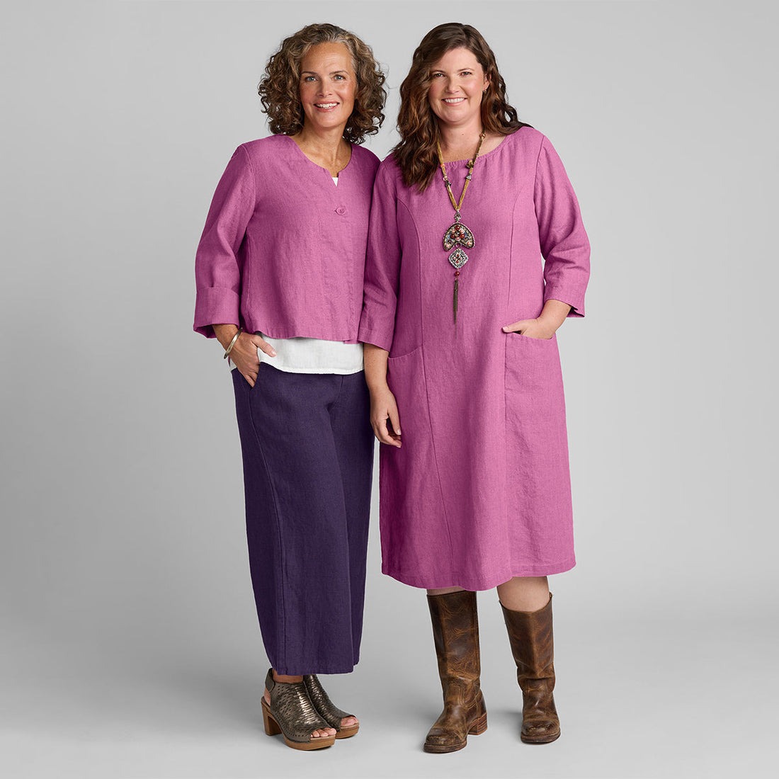 two women wearing FLAX linen clothes in pink and purple