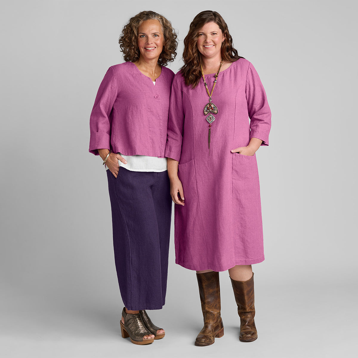 two women wearing FLAX linen clothes in pink and purple