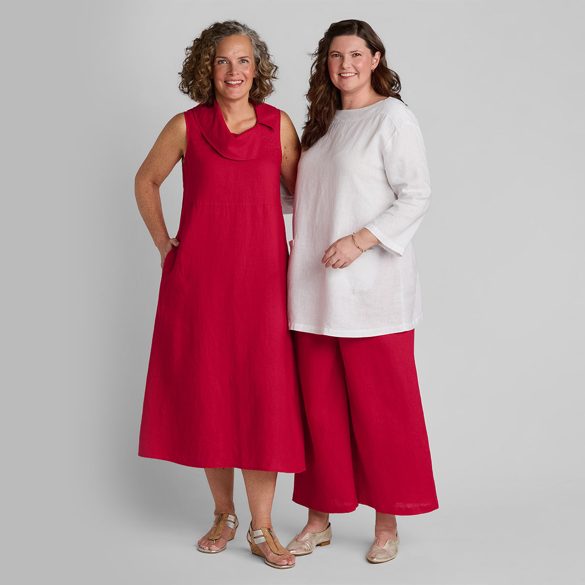 two women standing next to each other wearing FLAX linen clothing