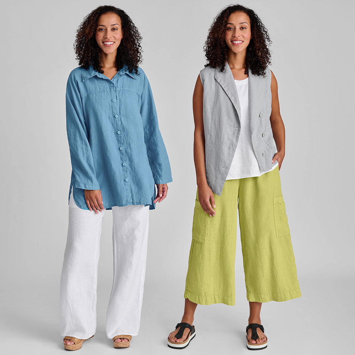 two women in white and bright colored linen outfits