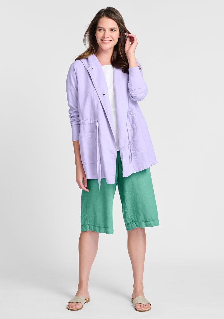 FLAX linen jacket in purple with linen shirt in white and linen shorts in green