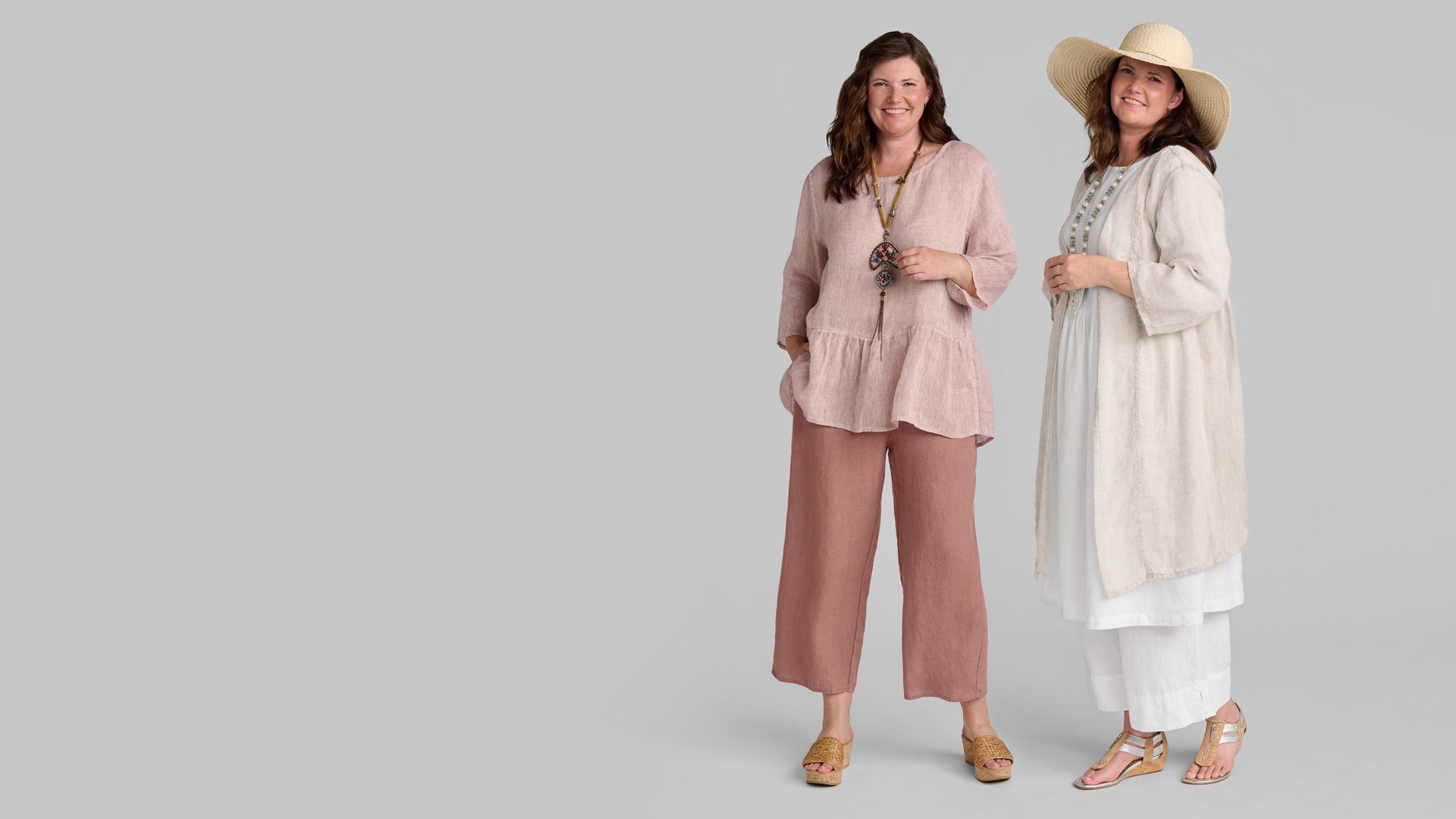 Two women in tan and pink FLAX brand women's linen clothing outfits