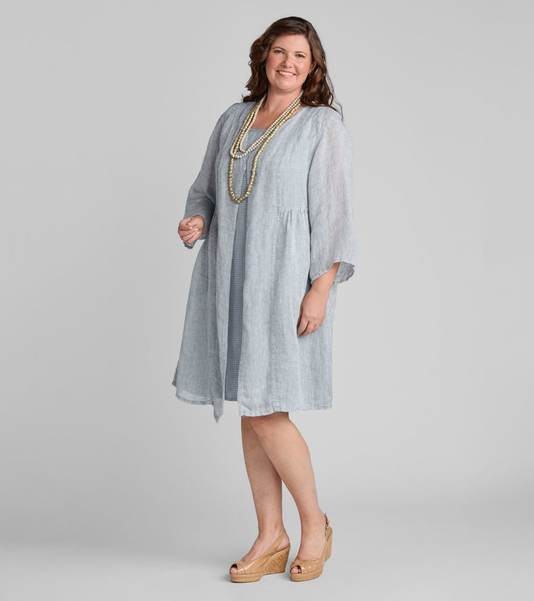 Woman in light blue FLAX women's linen clothing brand blue linen gauze jacket