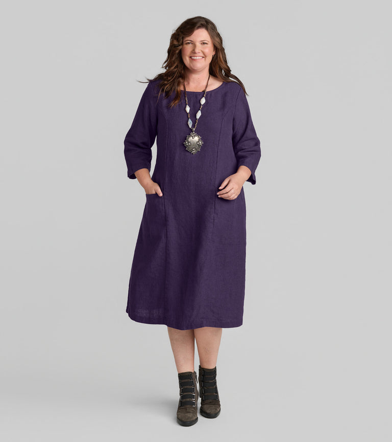 Woman in FLAX clothing brand purple linen dress