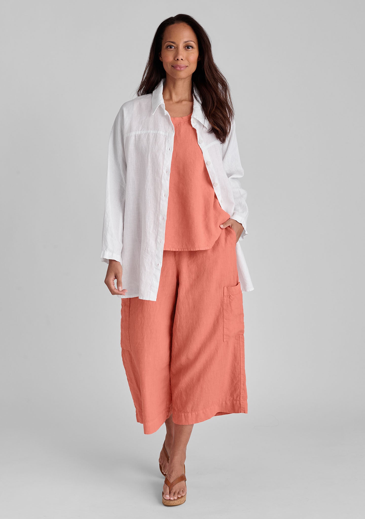 FLAX linen shirt in white with linen tank in orange and linen pants in orange