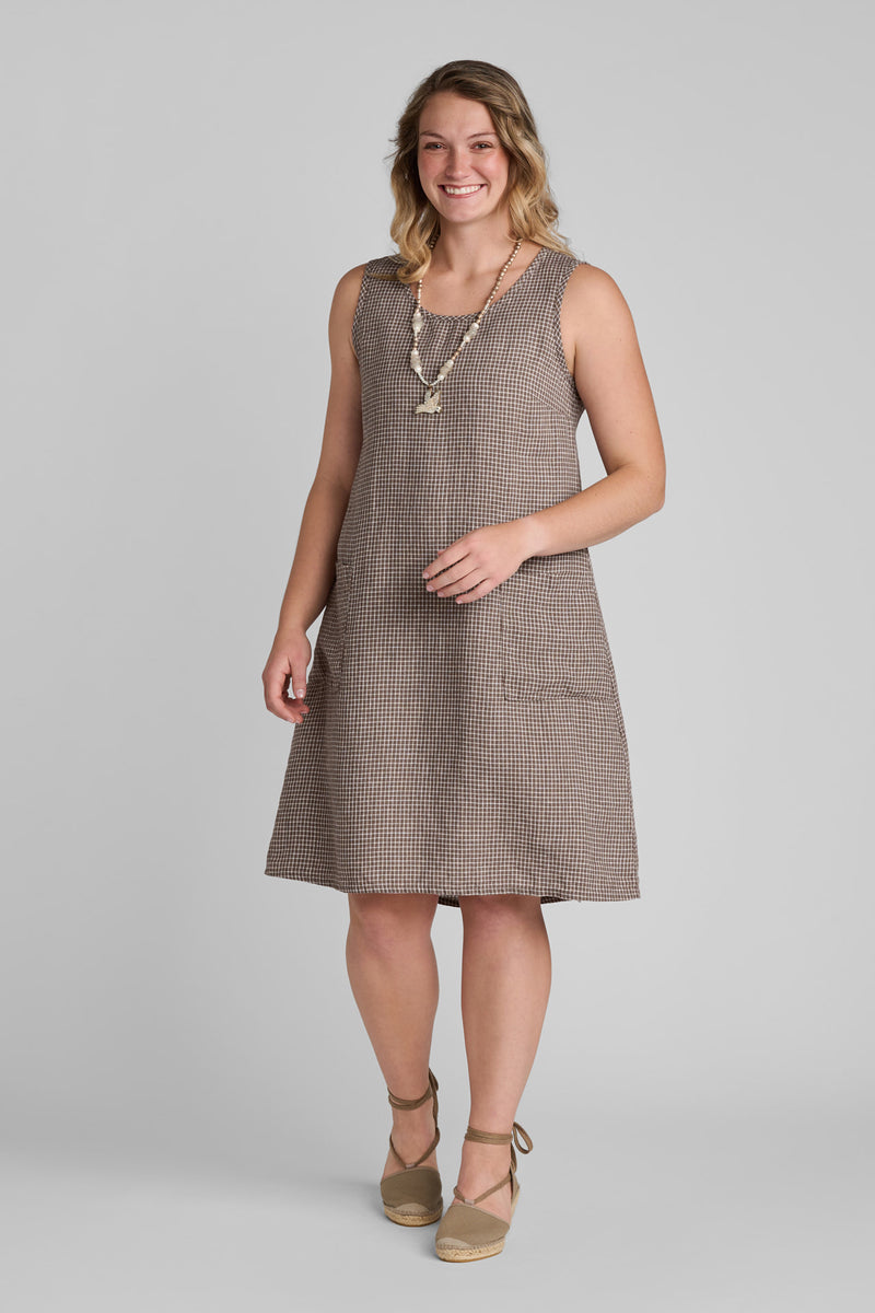Woman in FLAX clothing brand brown linen dress