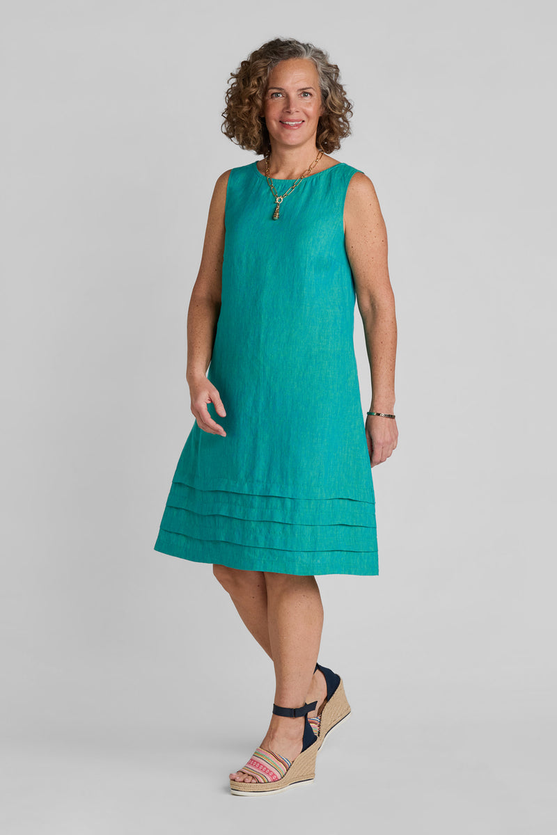 Woman in blue linen shift dress