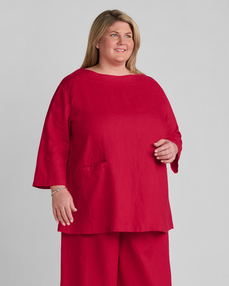 Woman in red linen shirt and red linen pants