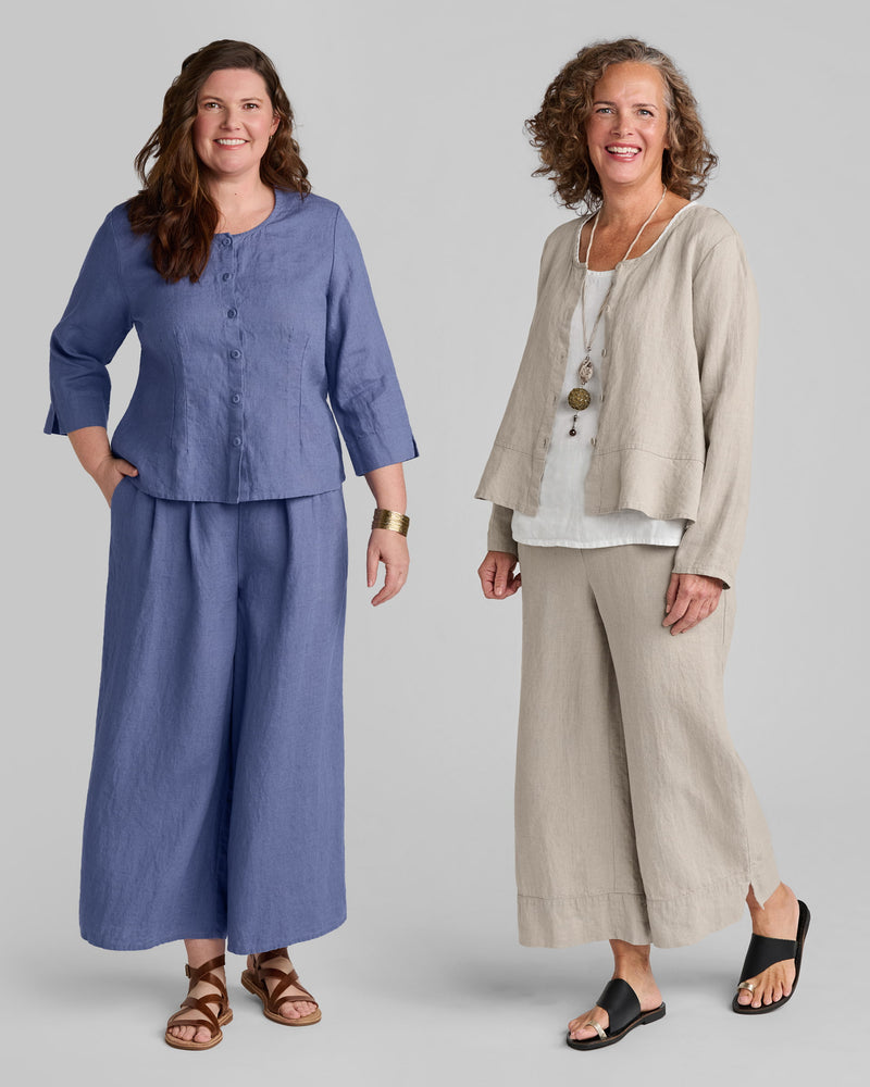 Woman in a blue linen outfit and another woman in a beige linen outfit