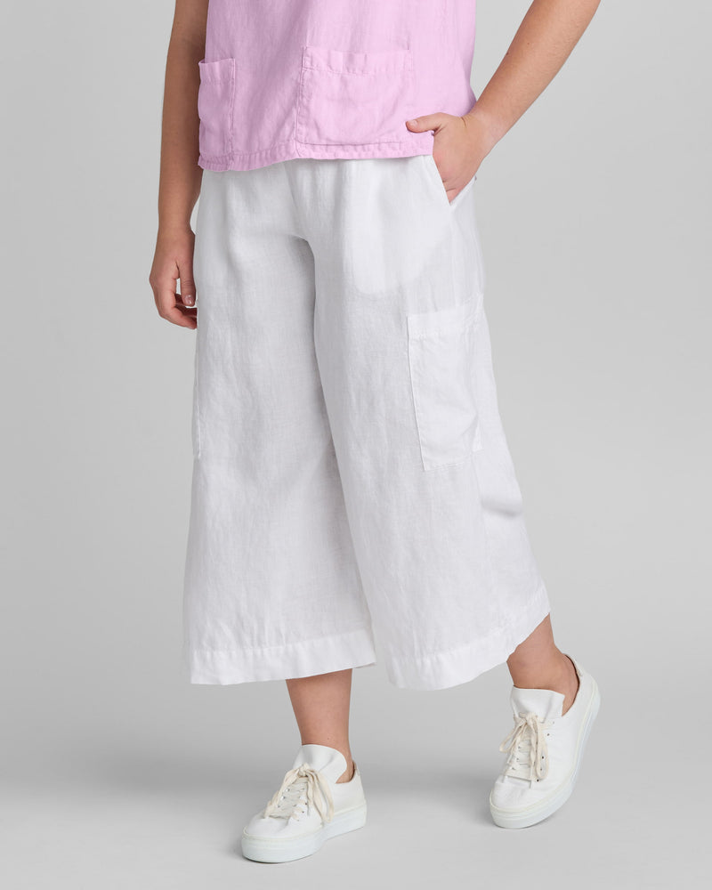 Woman in white linen pants
