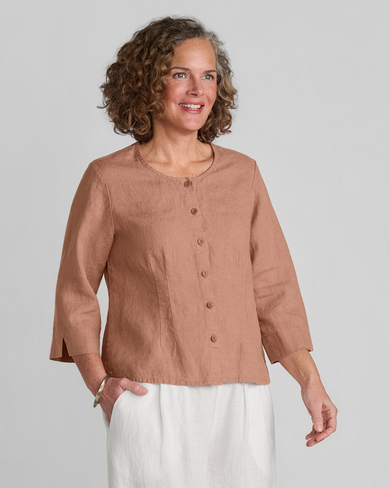 Woman in FLAX clothing brand brown linen shirt