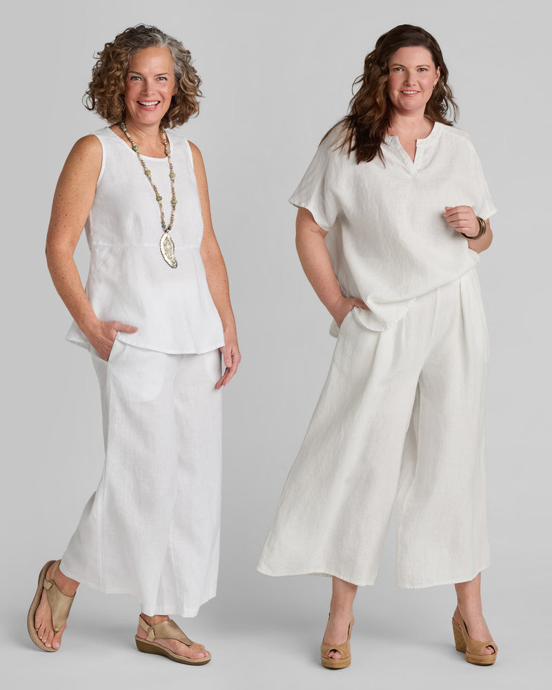 Two women in white linen outfits