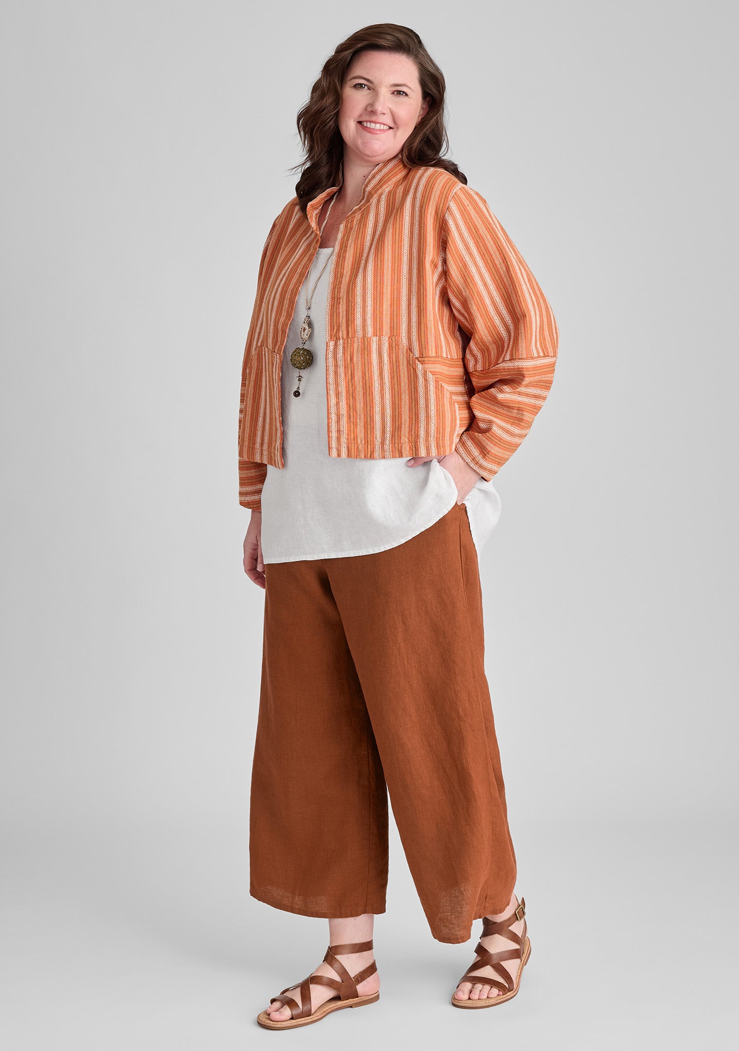 FLAX linen jacket in orange with linen tank in white and linen pants in orange