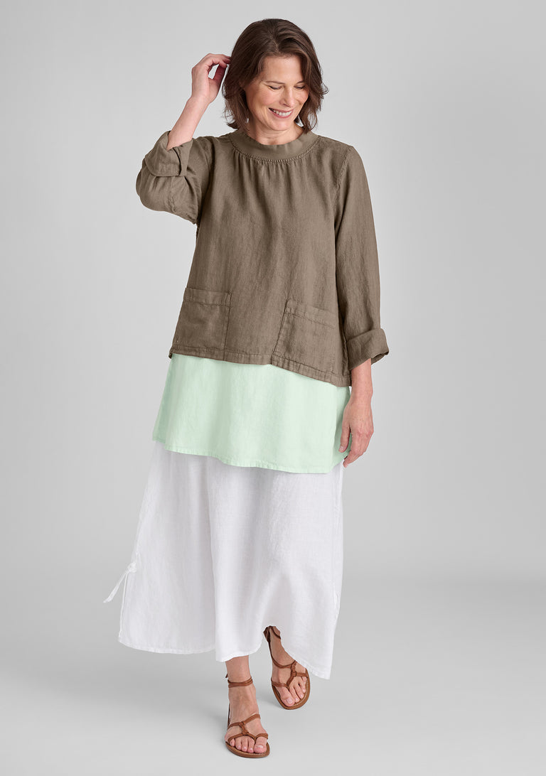 FLAX linen shirt in brown with linen tank in green and linen skirt in white