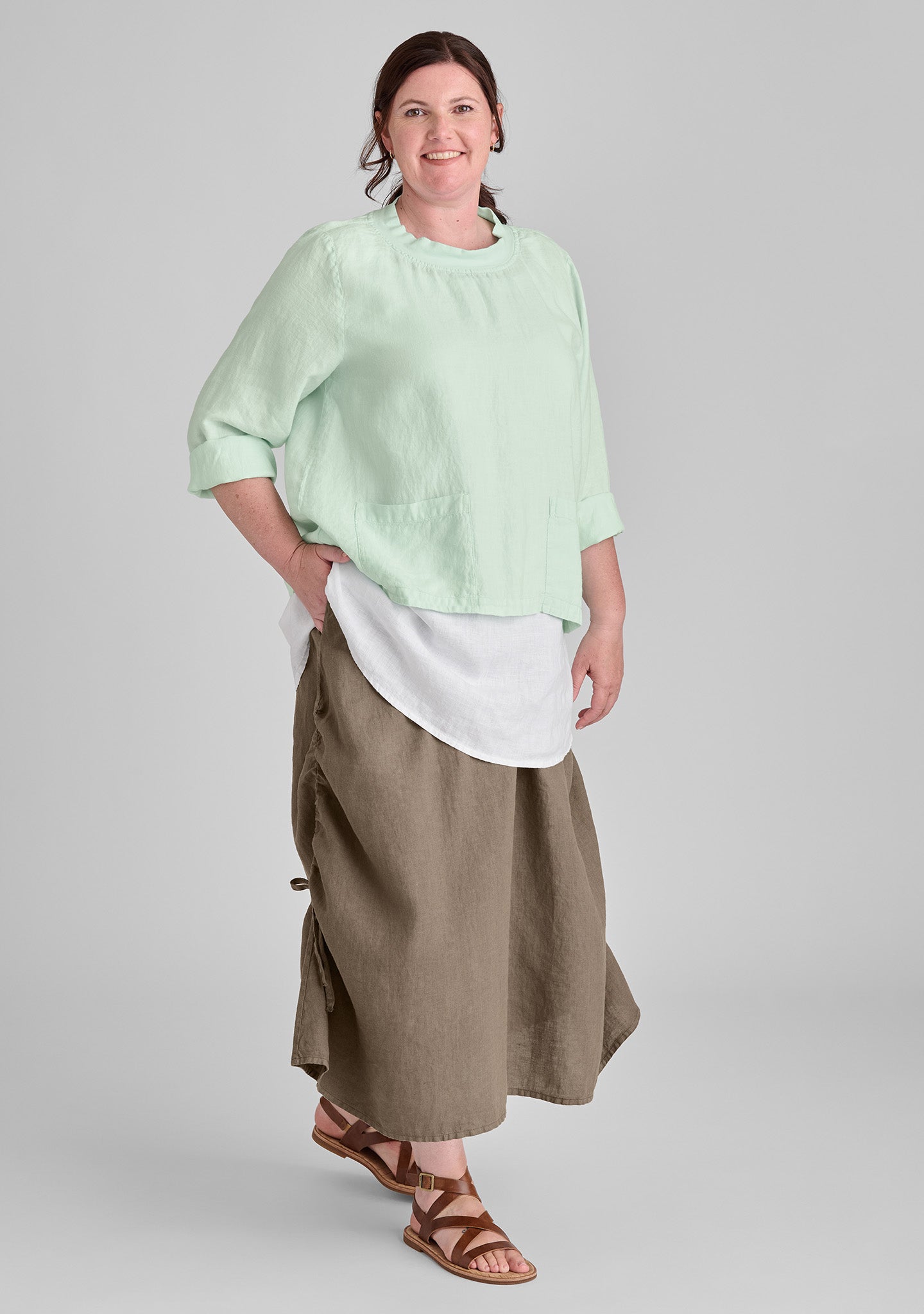 FLAX linen shirt in green with linen tank in white and linen skirt in brown