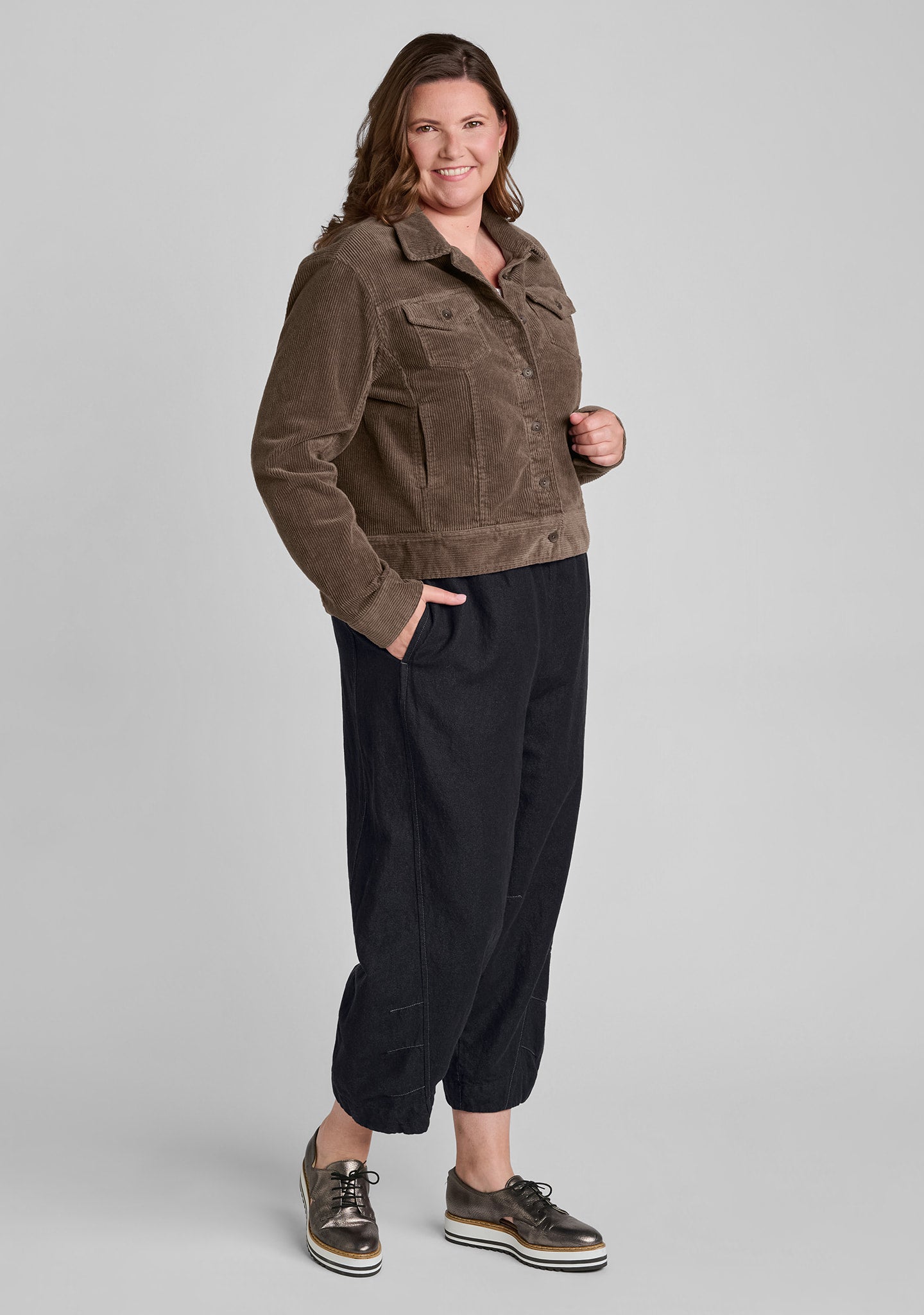brown corduroy jacket with denim pants in black