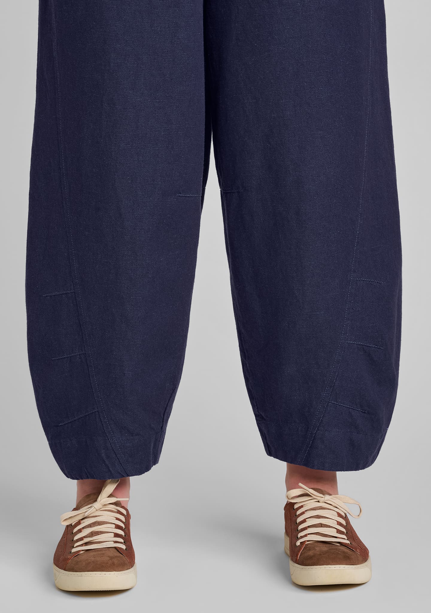 view of seaming details at hem on barrel pants in blue