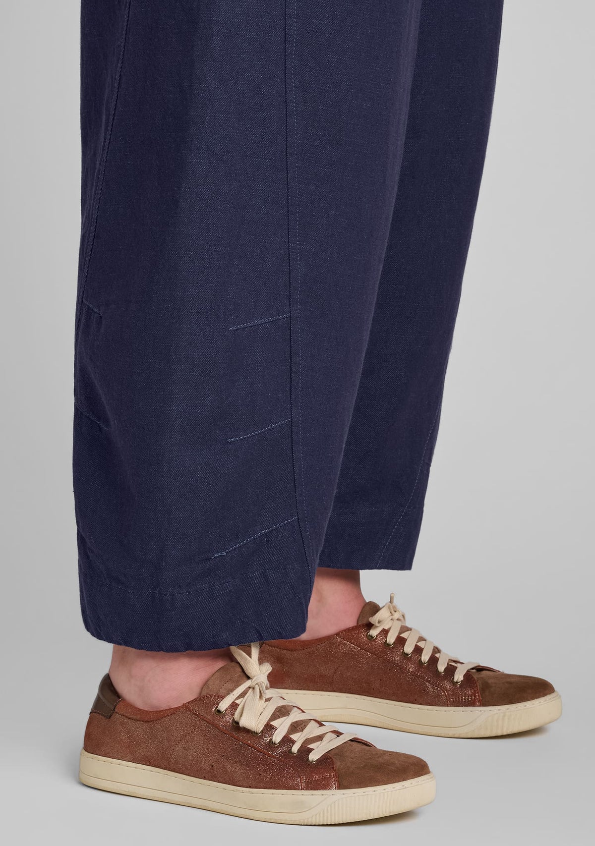 close up of seaming details on the leg of barrel pants