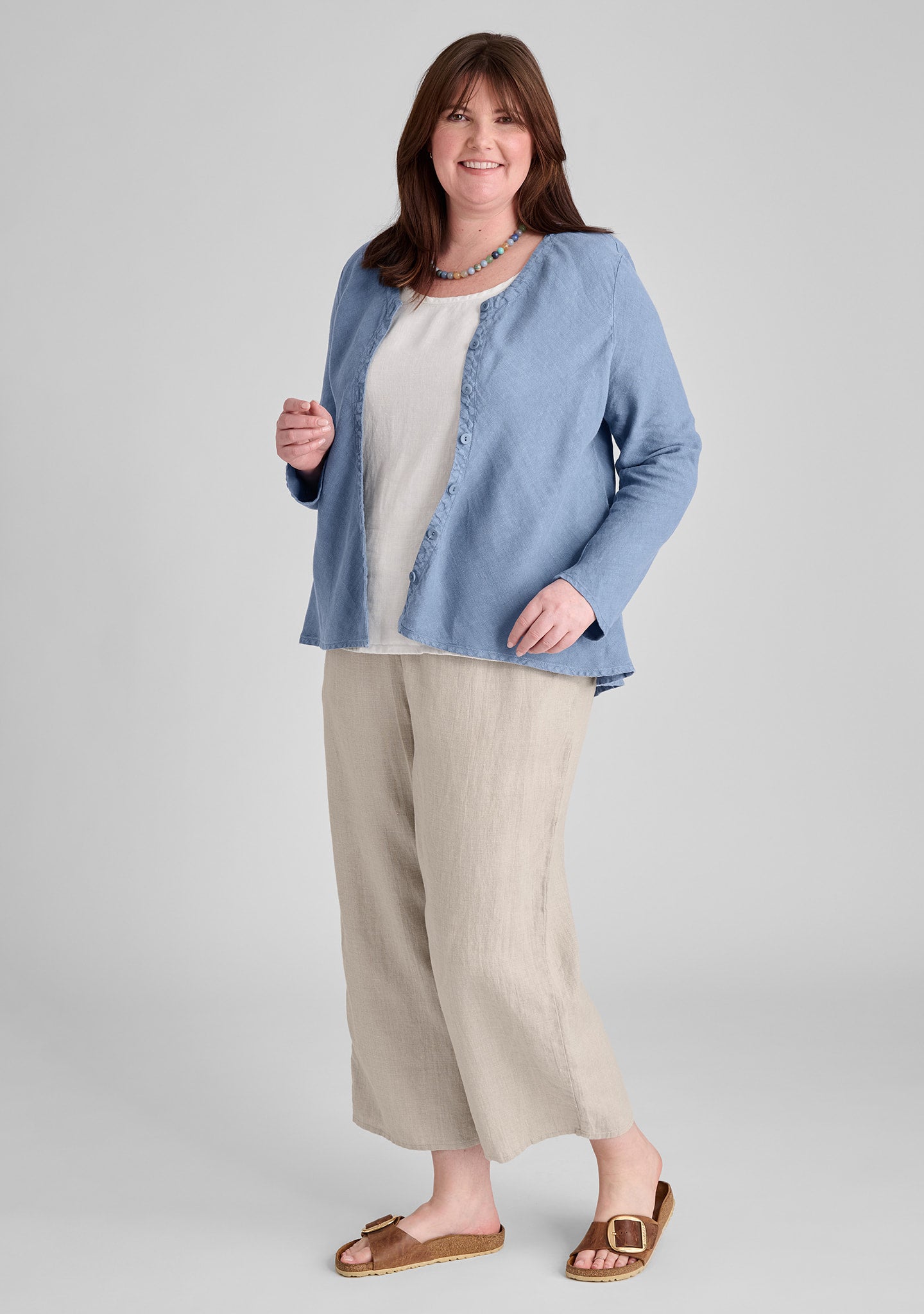 FLAX linen blouse in blue with linen tank in white and linen pants in natural
