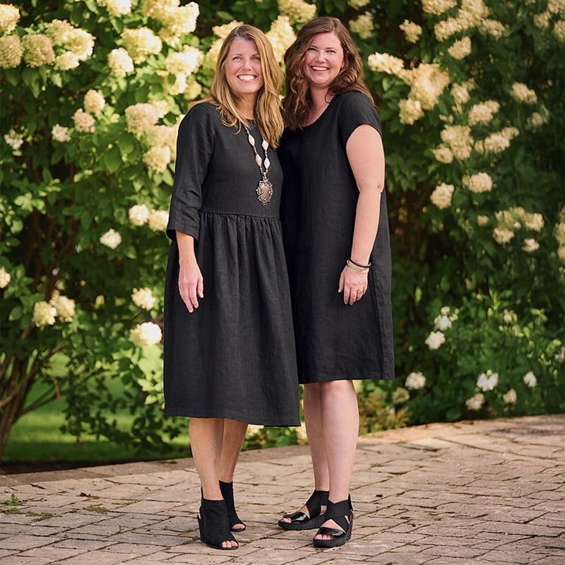 Women in black linen dresses