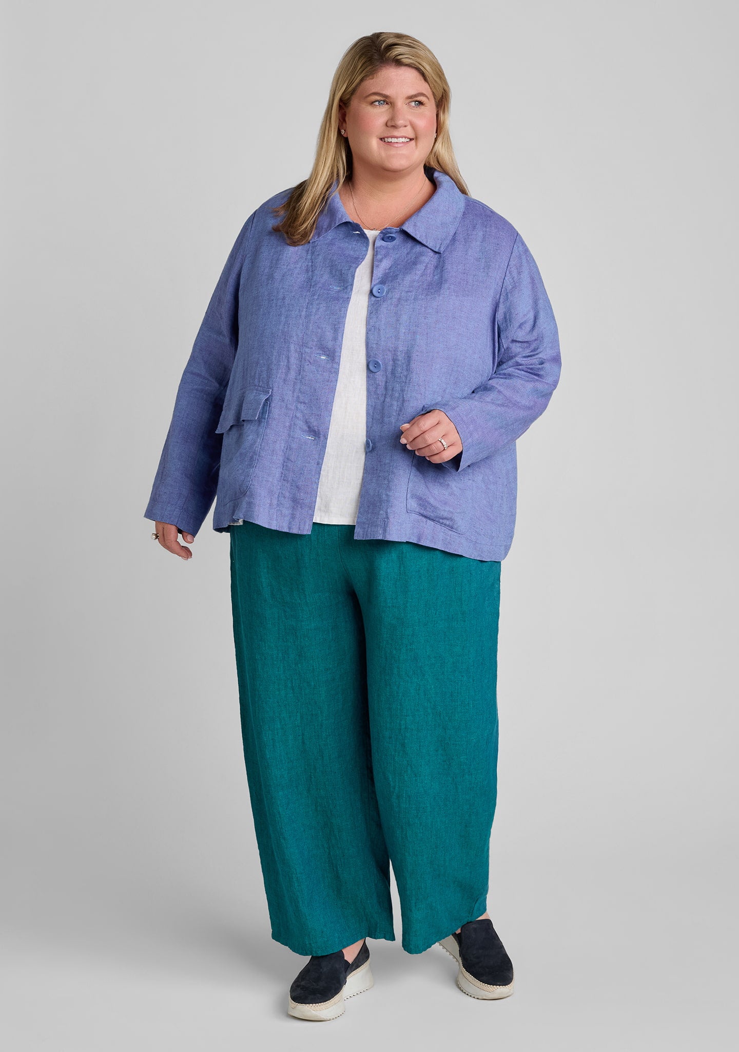 woman wearing a linen outfit featuring a purple jacket in size 1G