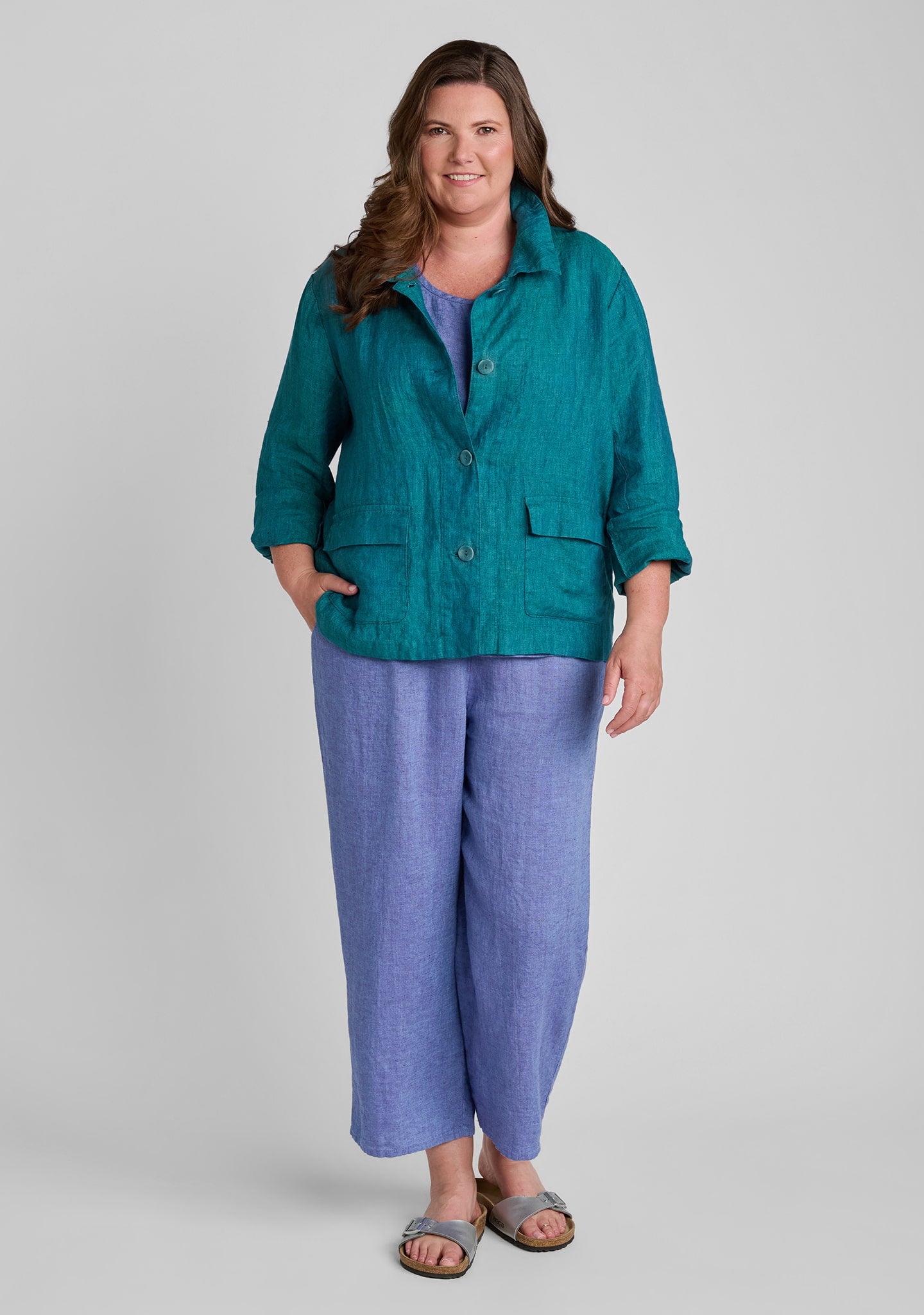 FLAX linen jacket in green with linen tank top in purple and linen pants in purple
