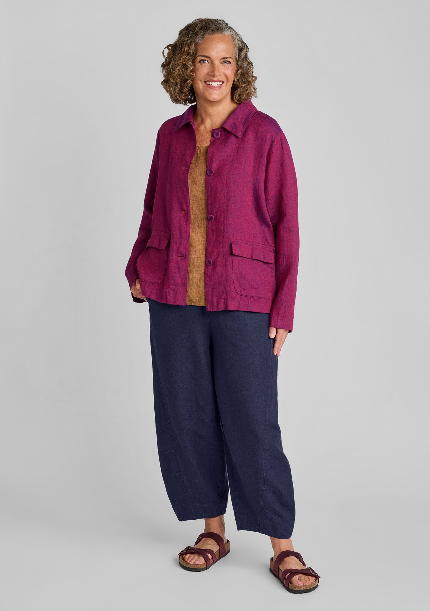 FLAX linen jacket in red with linen tank in brown and linen blend pants in blue