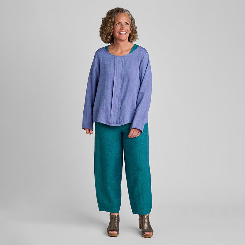 Woman in purple yarn dye linen shirt and blue yarn dye linen pants