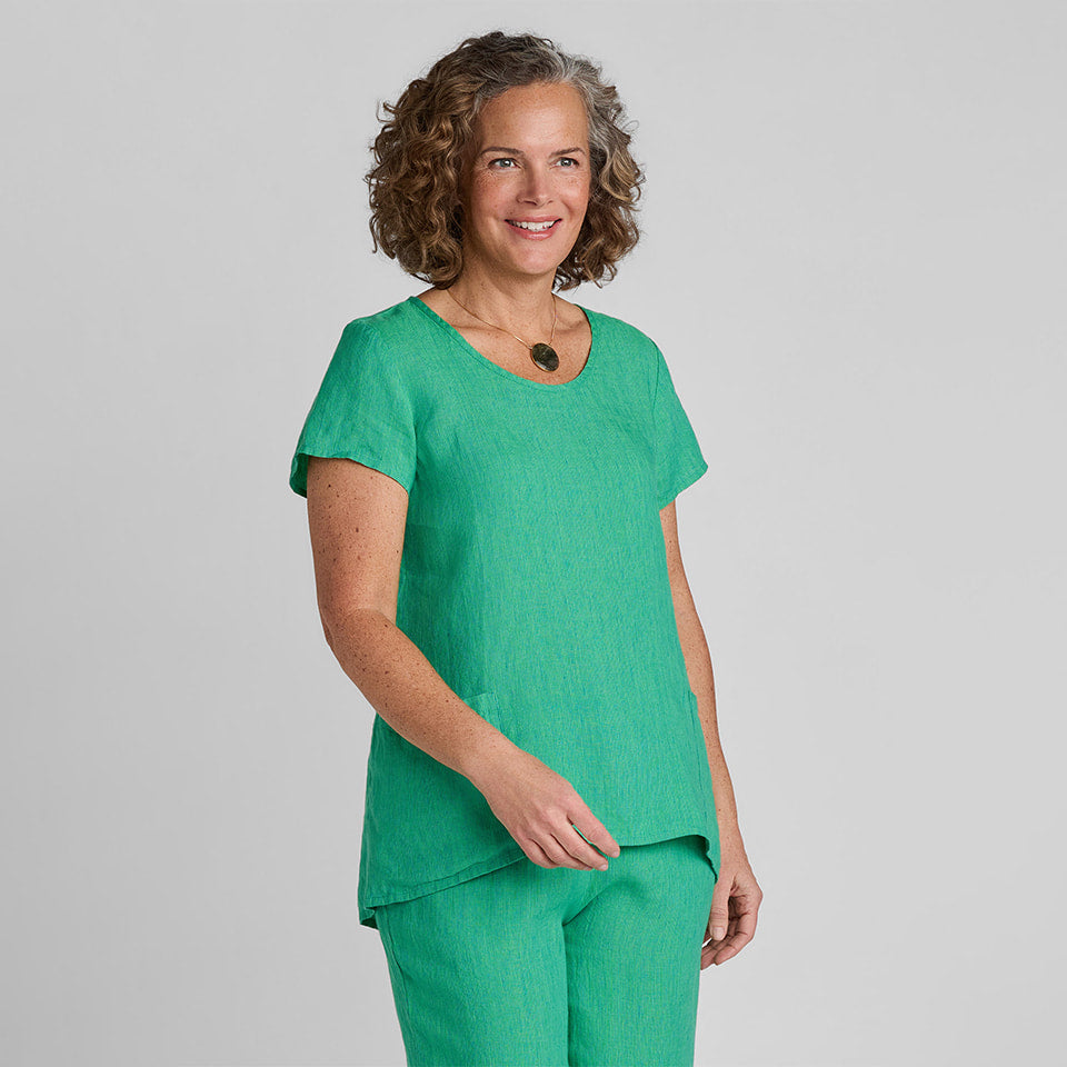 Woman in green linen tee shirt