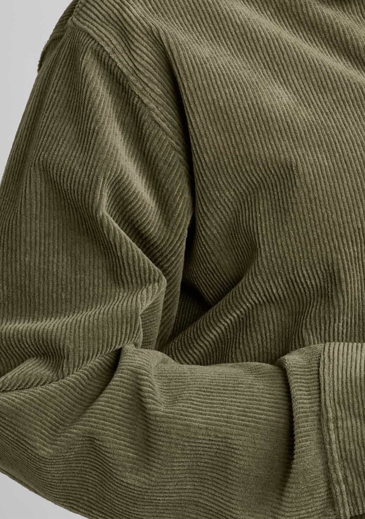 close up of corduroy fabric in green