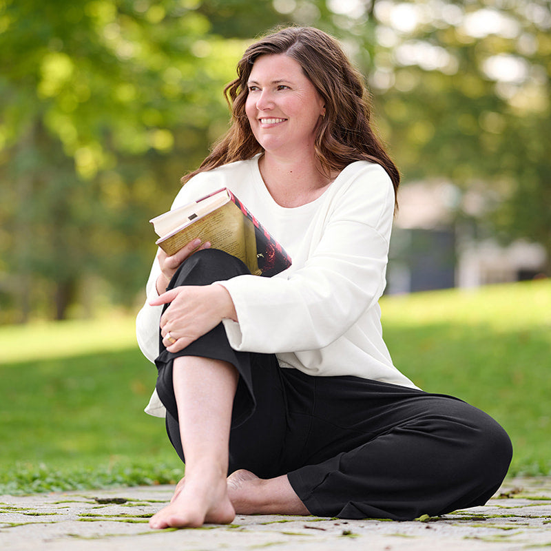 Woman in white shirt and black pants