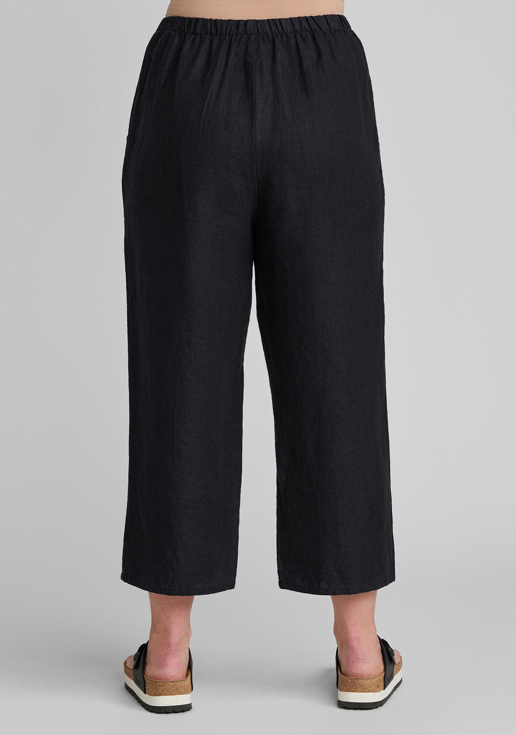 back view black linen cropped floods linen pants with elastic waist details