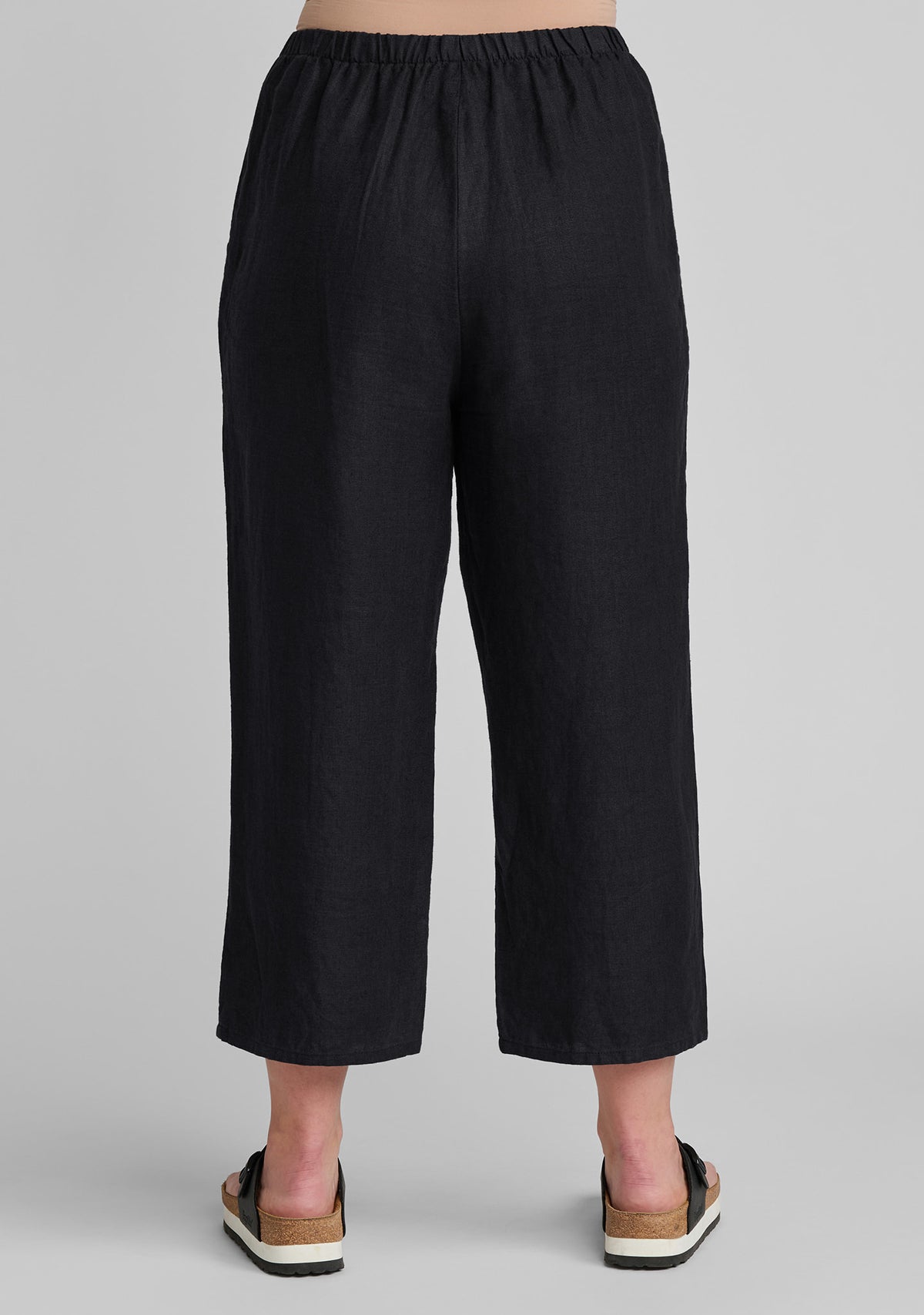 back view black linen cropped floods linen pants with elastic waist details