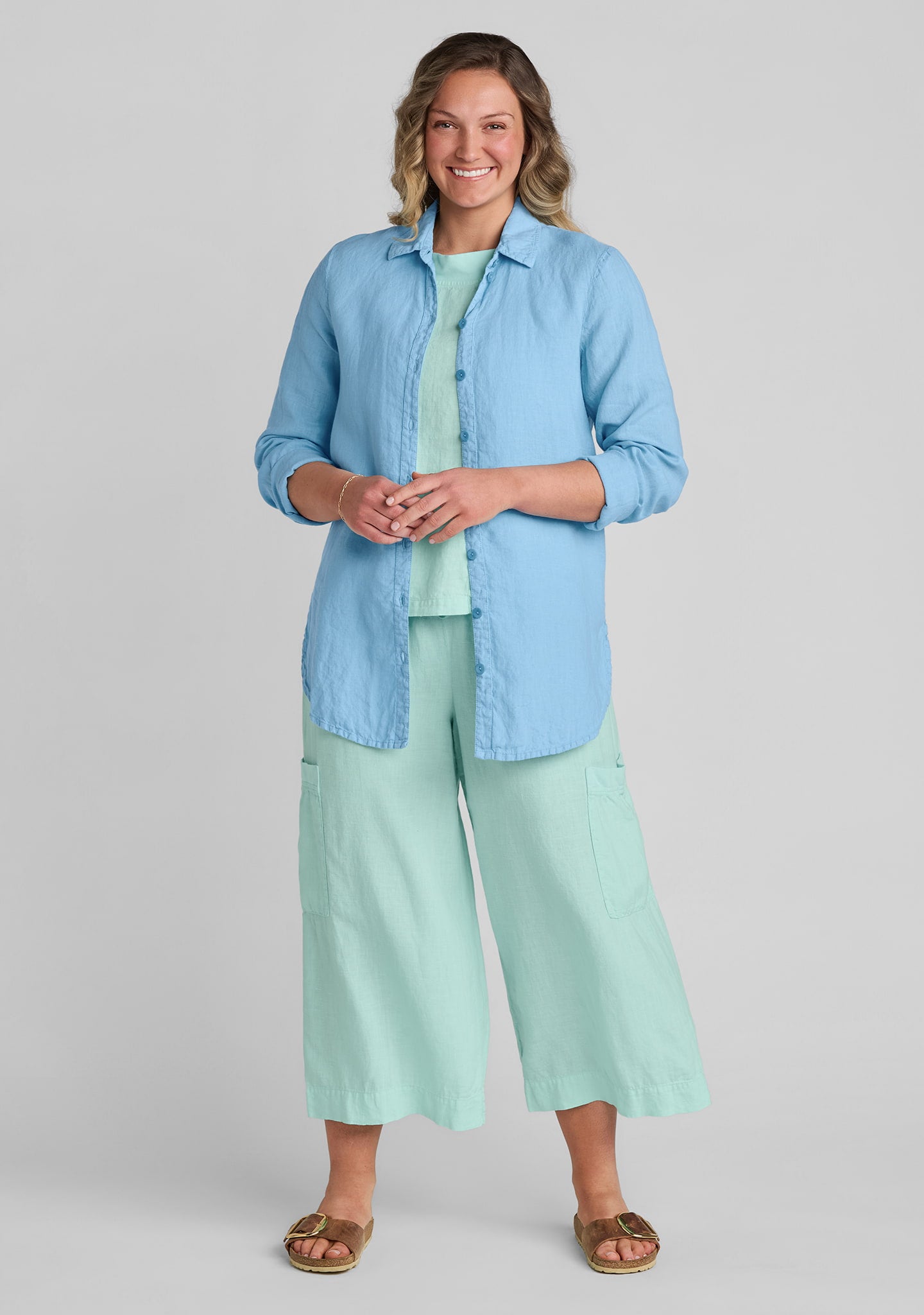 FLAX linen shirt in blue with linen tank top in green with linen pants in green