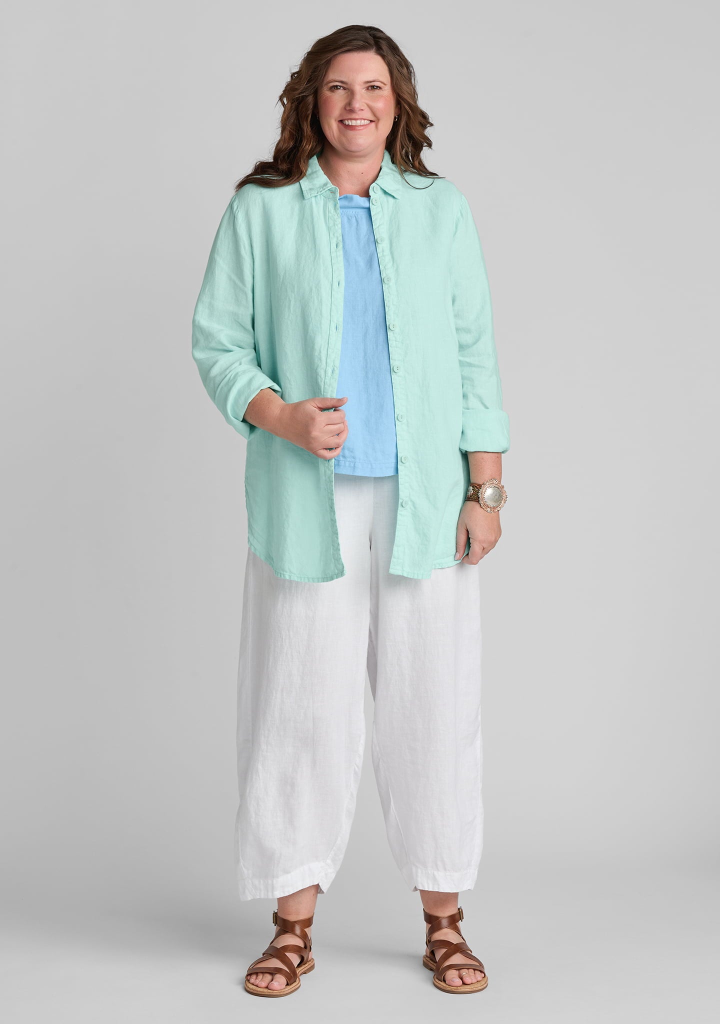 FLAX linen shirt in green with linen tank top in blue and linen pants in white