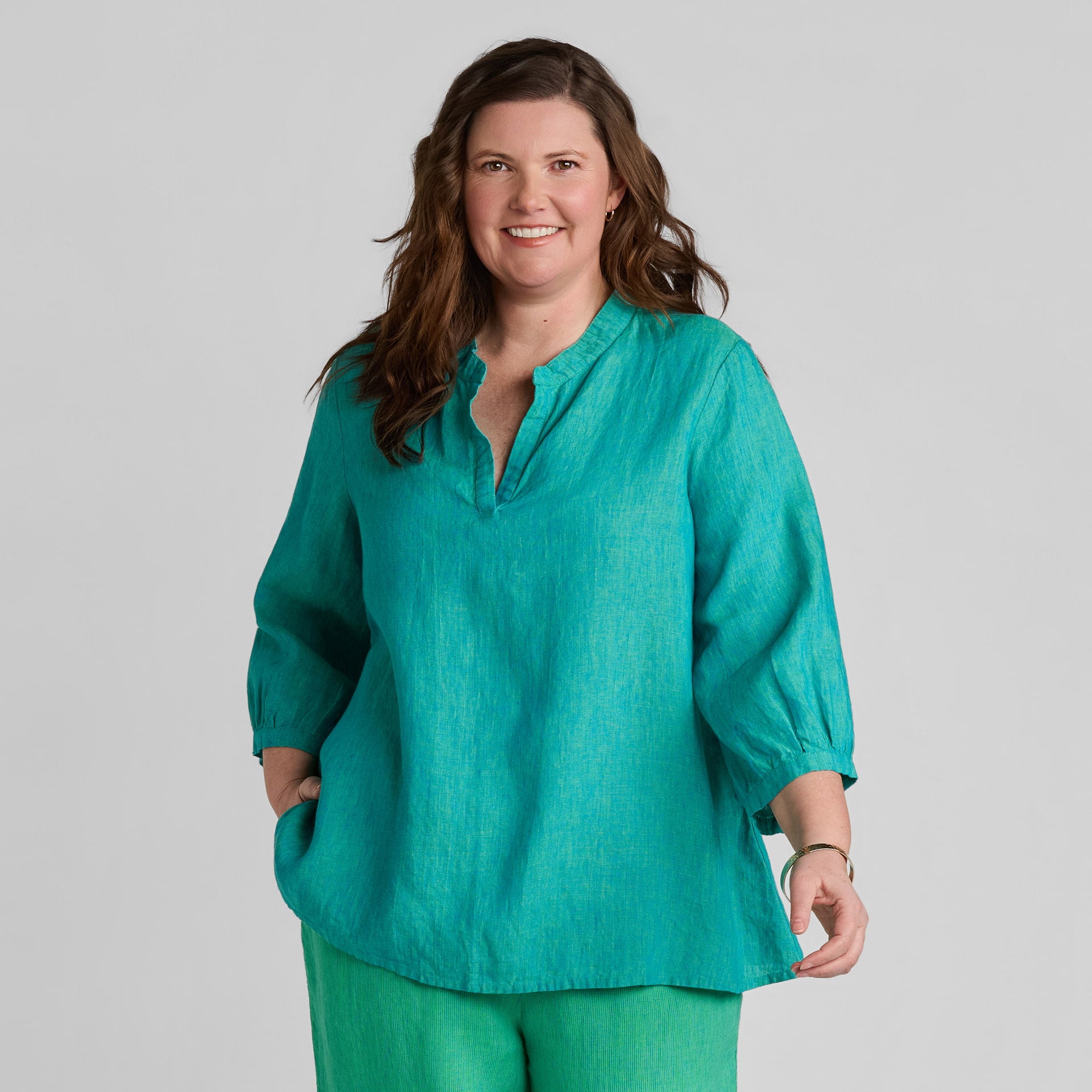 Woman in green linen shirt