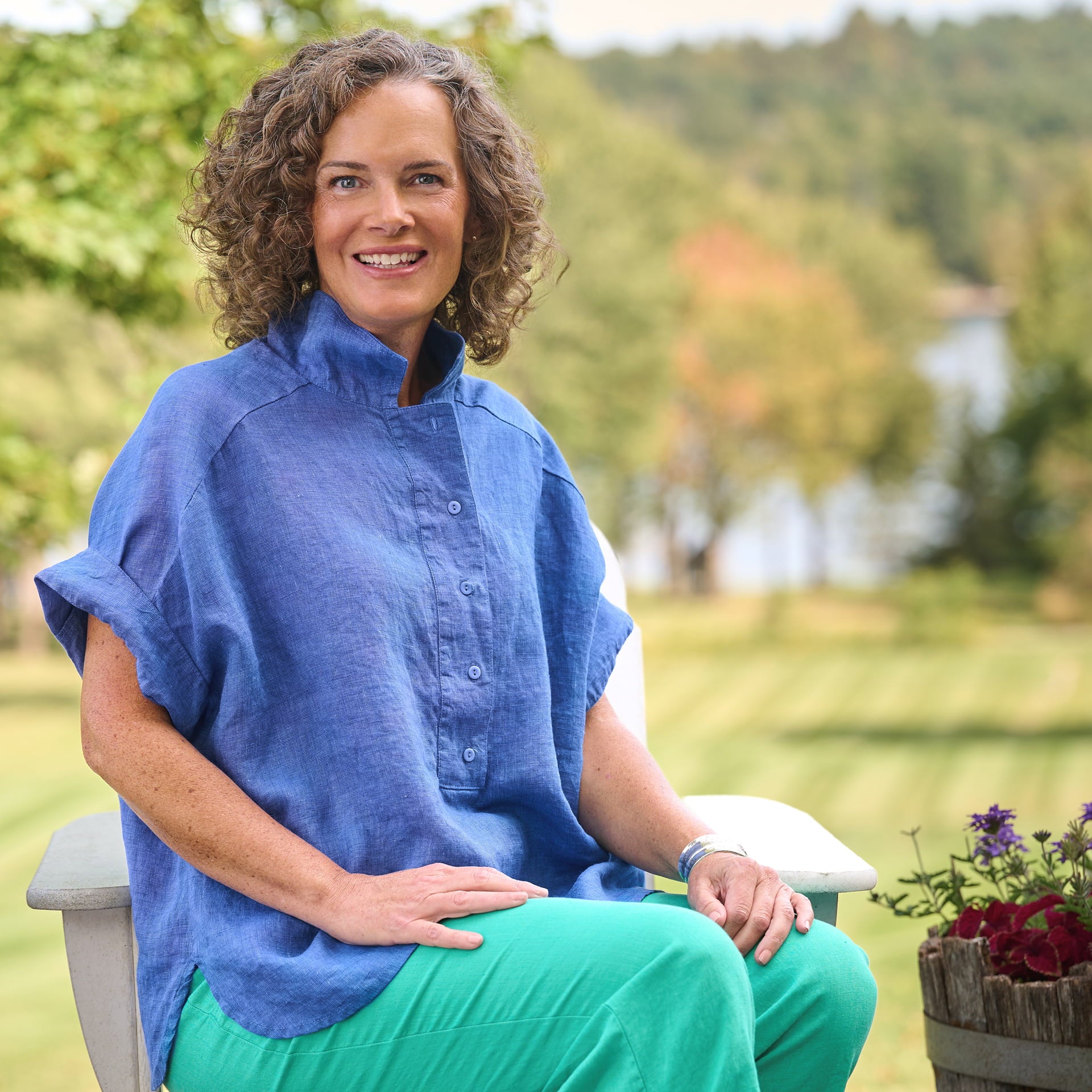 Woman in FLAX clothing brand blue linen shirt