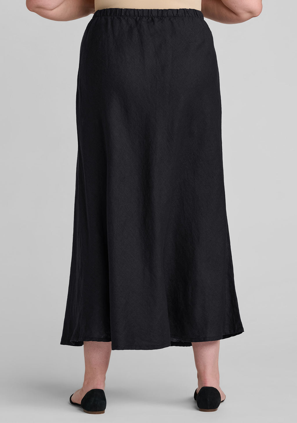back view of elastic waist and drape of women's linen skirt in black