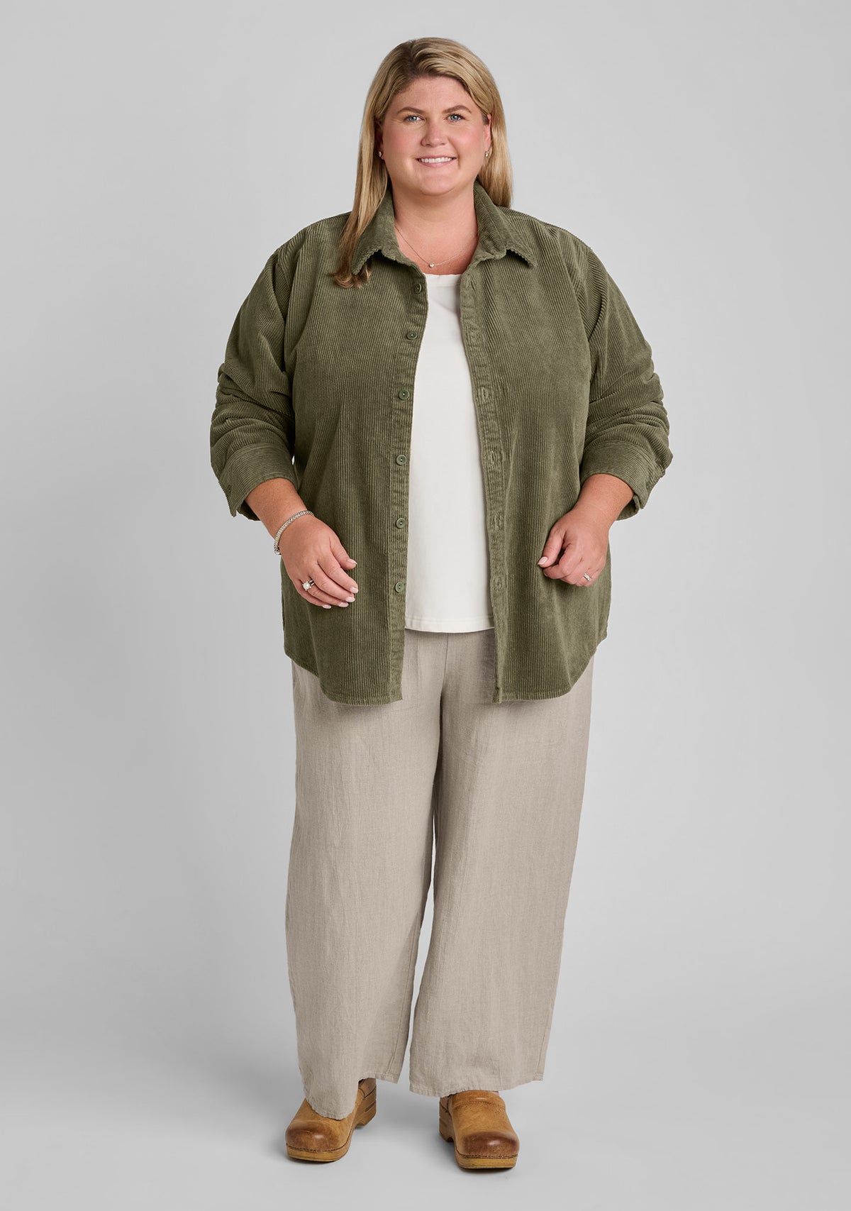 cotton blend corduroy shirt in green with linen tank in white with linen pants in natural