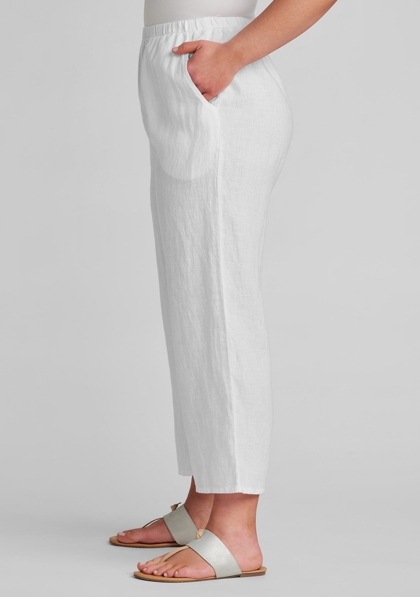 side view with hand in pocket for women's white linen pants
