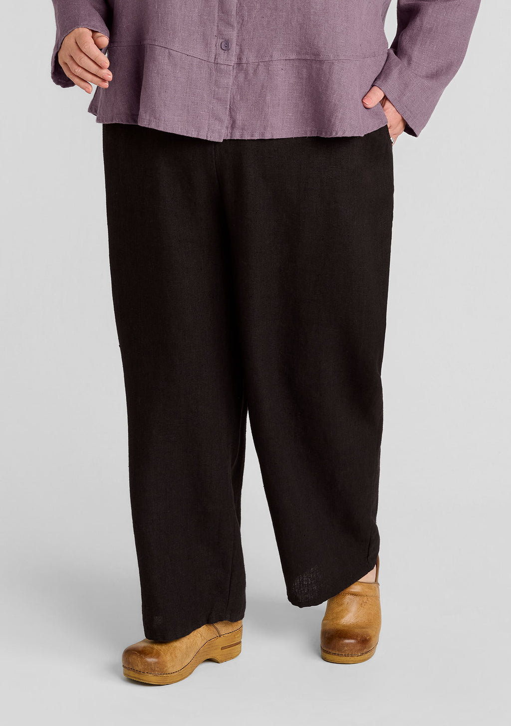 cropped linen pants in brown worn on a plus size model