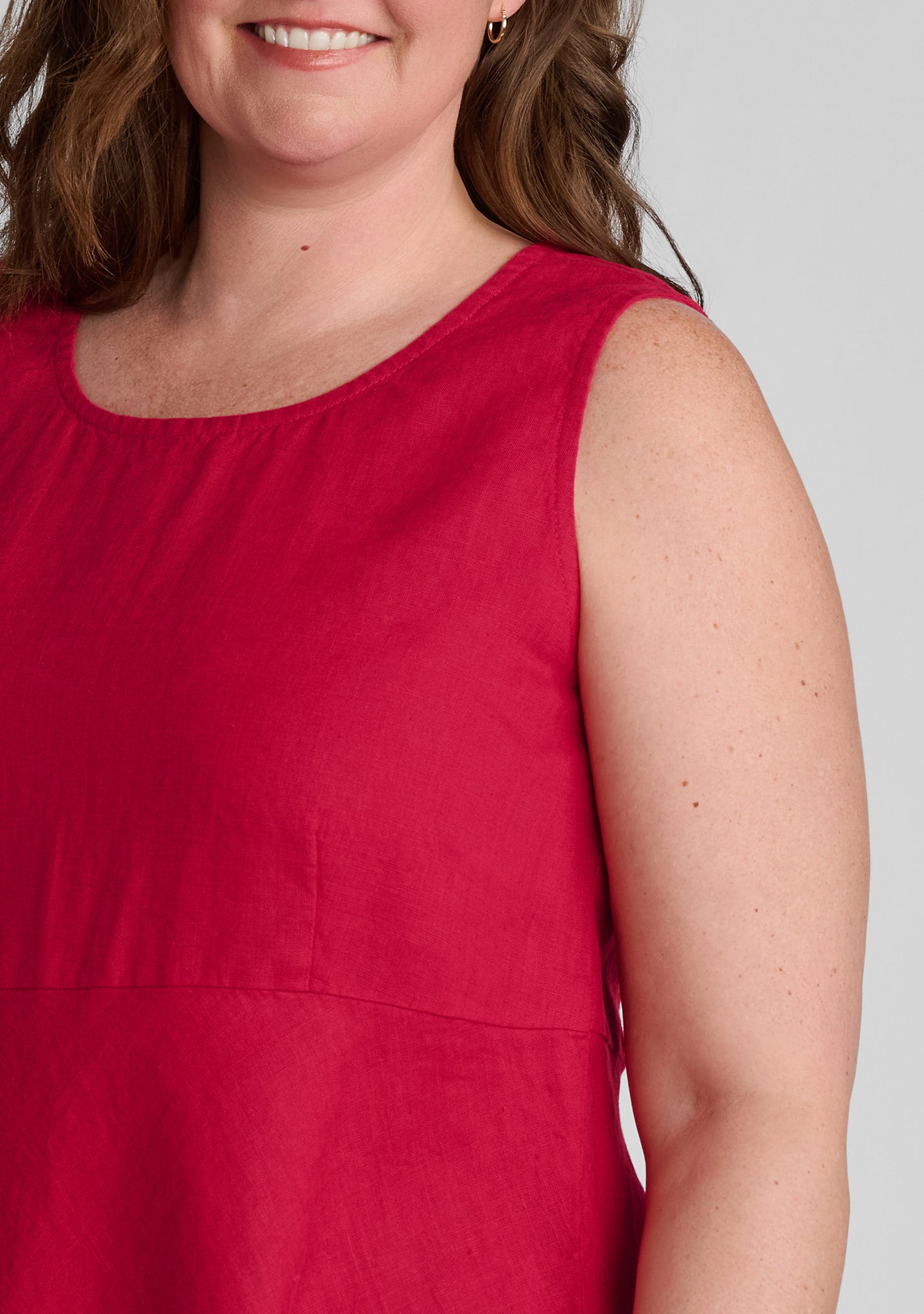 shoulder view of women's linen tank top in red