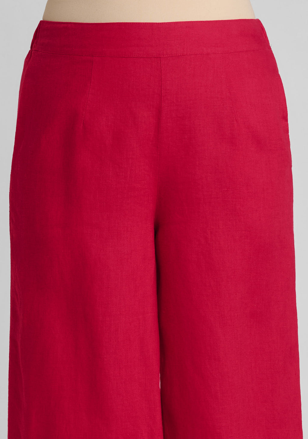 flat front waistband and pleat detail of women's linen pants in red